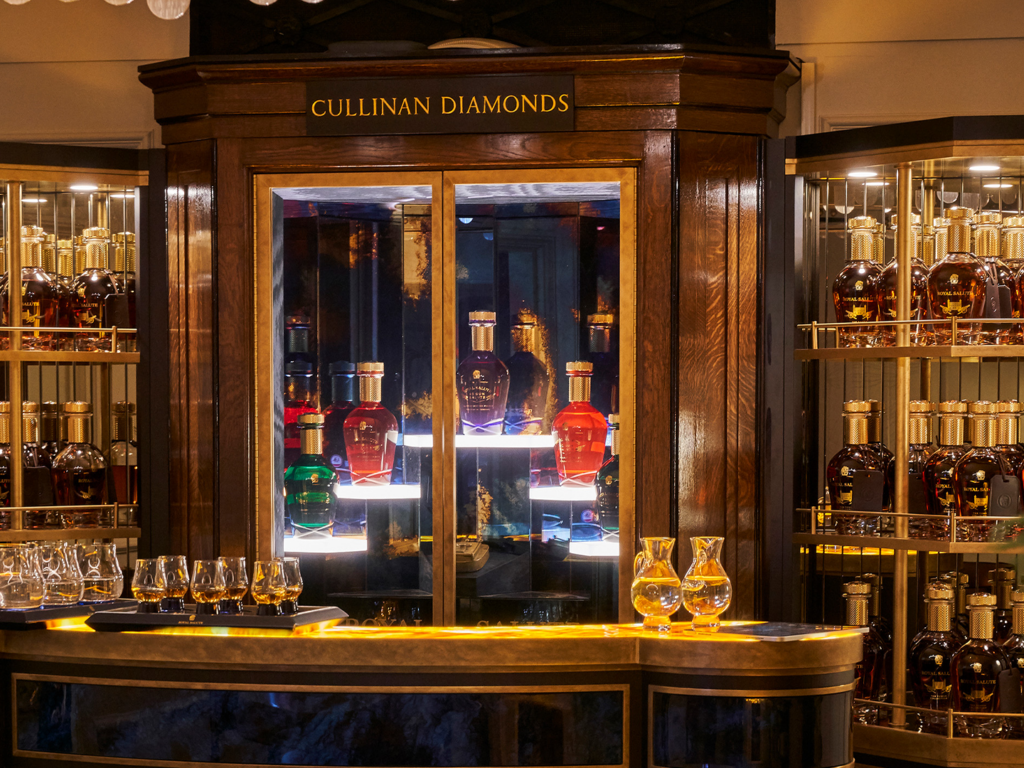 Luxury whisky tasting room and private dining experience inside the Tower of London, featuring Royal Salute display and bespoke interior design by Ellis Design Studio within a historic landmark setting